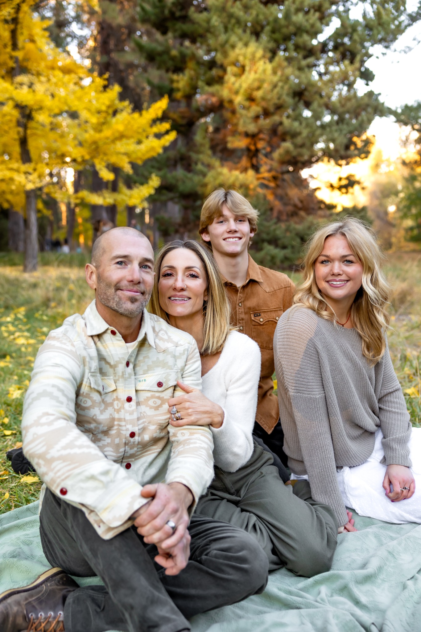 The Fletcher family together outdoors in autumn