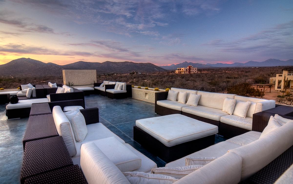 Outdoor lounge overlooking the landscape at sunset in Mexico