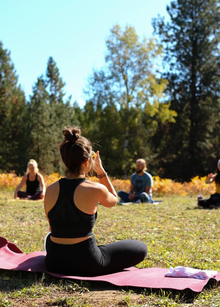 A person practicing outdoors with a group